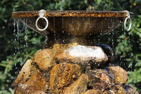 Premium Photo Close Up Of Water Falling From Fountain