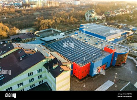 Aerial View Of Many Photo Voltaic Solar Panels Mounted Of Industrial