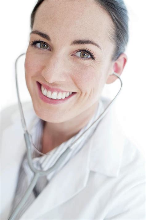 Female Doctor Wearing Stethoscope By Science Photo Library