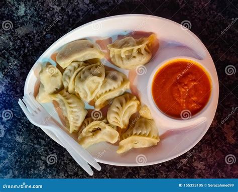 Chicken Momo Served with Sauce in a White Plate. Top View Stock Image ...