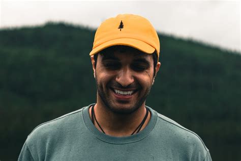 A Man In Gray Shirt Wearing Yellow Cap · Free Stock Photo