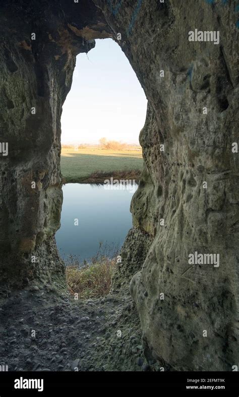 View Of Landscape From Inside A Cave Mouth Stock Photo Alamy