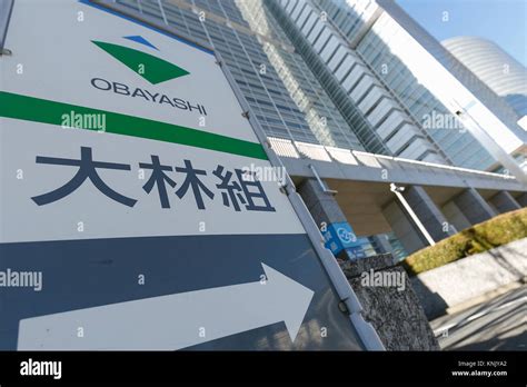 The Logo Of Obayashi Corp On Display Outside The Company Headquarters