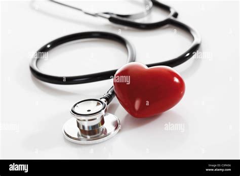 Stethoscope With Heart Shape Object On White Background Close Up Stock