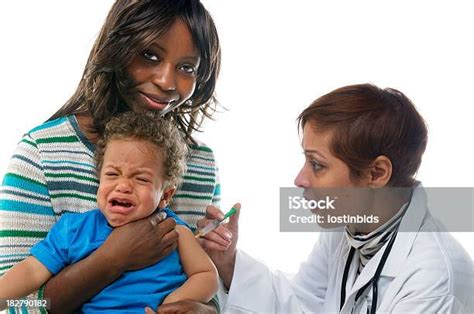 Baby Crying While Having An Injection Stock Photo - Download Image Now ...