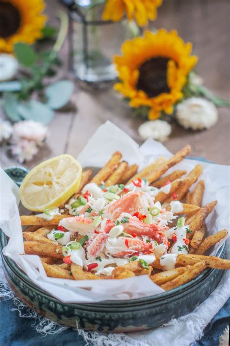 Loaded Crab Fries On Brown Table With Sunflowers In The Background French Fries Recipe Crispy