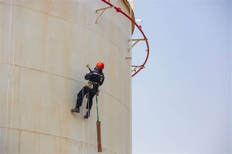 Premium Photo Male Worker Rope Access Inspection Of Thickness Storage