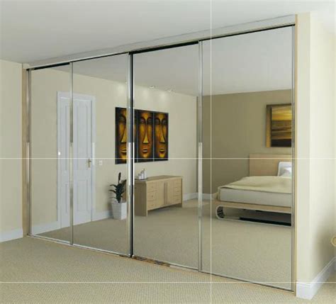 An Image Of A Bedroom With Mirrored Doors