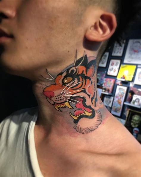 Neo Japanese tiger portrait tattoo on the neck.