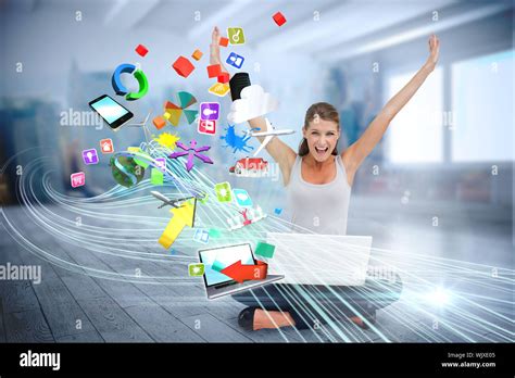 Digital Composite Of Cheering Blonde Using Laptop With App Icons Stock
