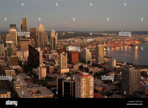 Seattle Skyline With Mount Rainier And Downtown Building At Sunset With