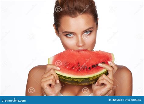 Beautiful Brunette Woman Eating Watermelon On A White Background