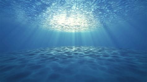 Blue Ocean Bottom With Bubbles And Light Rays Deep Underwater