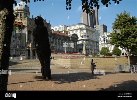 Anthony Gormleys Iron Man Statue And Stationary Woman Victoria Square