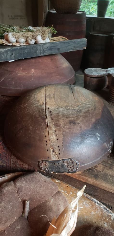 An Old Wooden Shoe Sitting On Top Of A Table Next To Other Woodworking