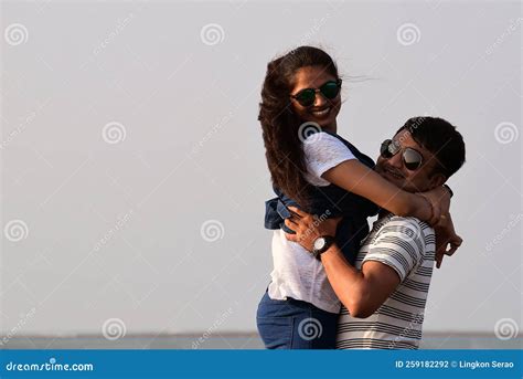 Closeup Of A Man Lifting Woman Happy Couple Hugging Each Other At The