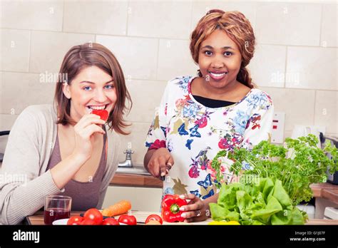 Happy Friends Cooking Together Stock Photo Alamy