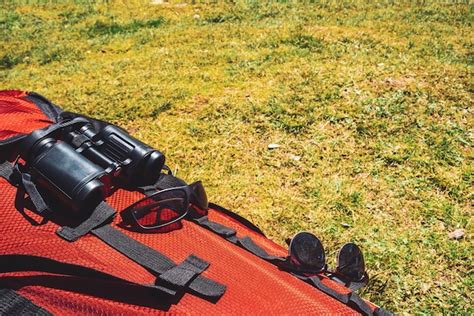 Premium Photo Big Red Camping Backpack With Traveler Items