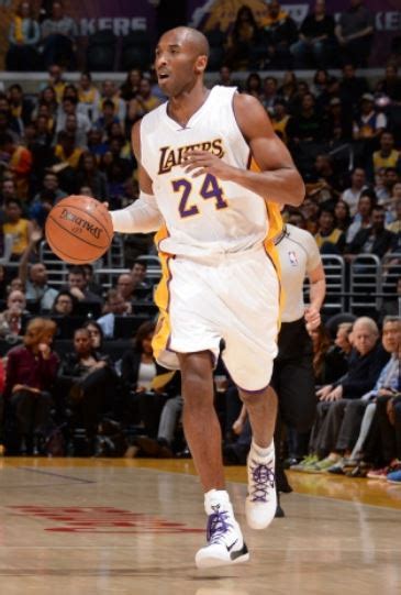 Kobe Bryant Dribbles the Ball Upcourt in White Laker Home Jersey.JPG