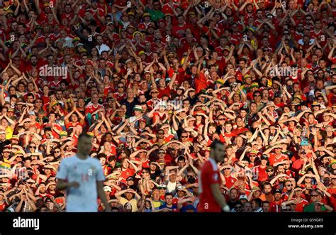 Wales Fans Shield Their Eyes From The Sun In The Stands During The Uefa