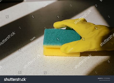 Hand Yellow Rubber Glove Washing Surface Stock Photo 1373930084