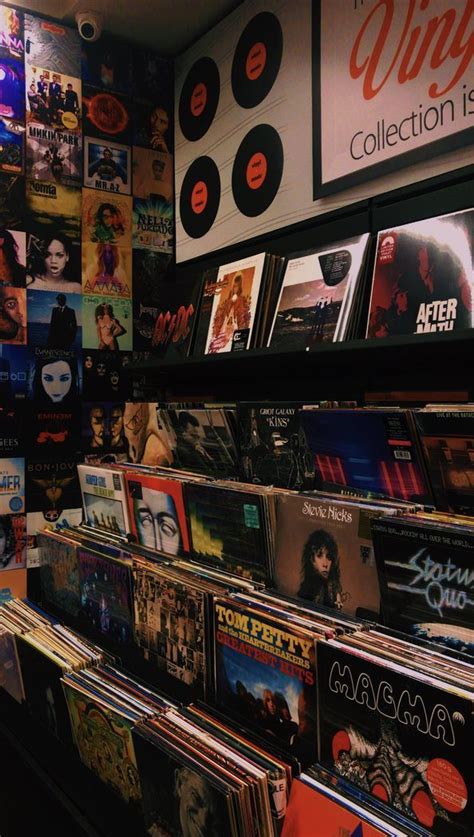 A Record Store With Various Records On The Wall And Posters On The Wall