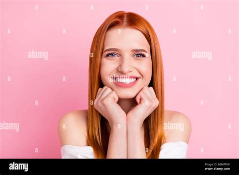 Photo Of Positive Pretty Young Redhead Woman Hold Fists Good Mood Smile