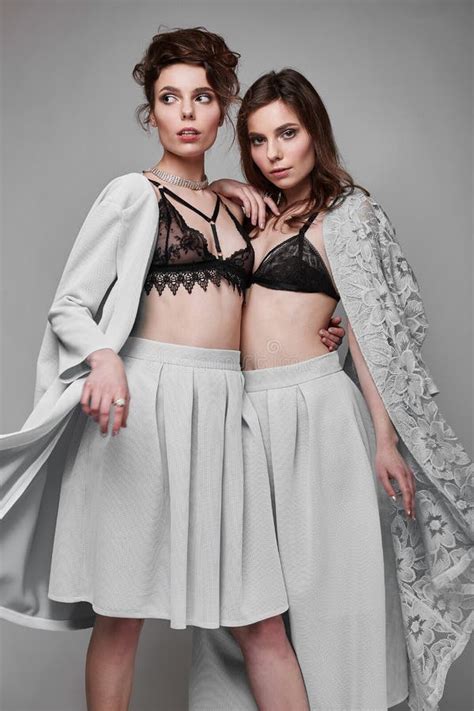 Portrait Of Two Beautiful Sensual Brunette Models Twins Stock Photo Image Of Curly Gray