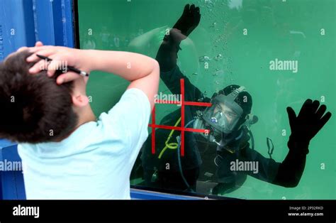 Naval Base Kitsap Bangor Navy Diver Tanner Cline Raises His Arms In