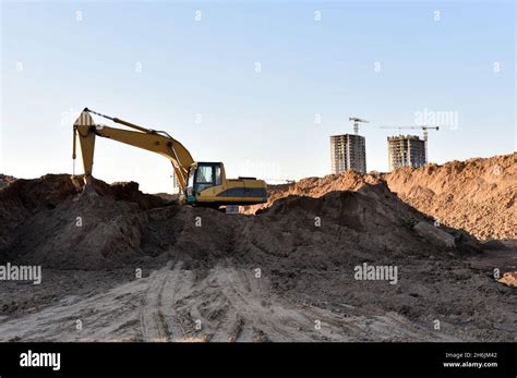 Excavator Dig Trench At Construction Site Digging The Pit Foundation Laying Concrete Sewer