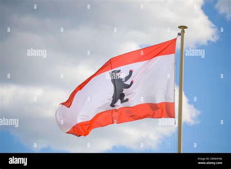 Berlin flag waving in the wind. Flag of German state Berlin flying on a ...