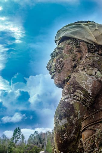 Big Stone Statue By Blue Sky In Bali Indonesia Stock Photo Download
