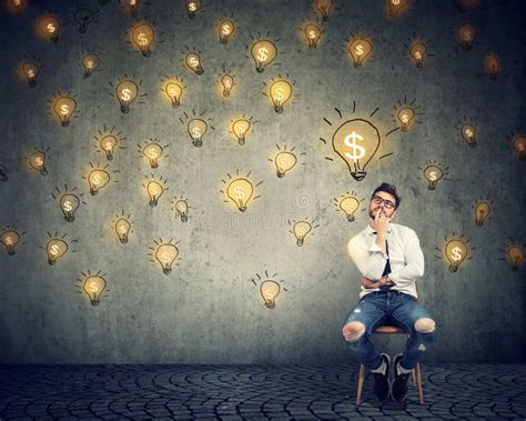 Thinking Freelancer Man Sitting On Chair Looking Up At Many Dollar Idea