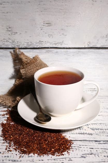 Premium Photo Cup Of Tasty Rooibos Tea On Old White Wooden Table