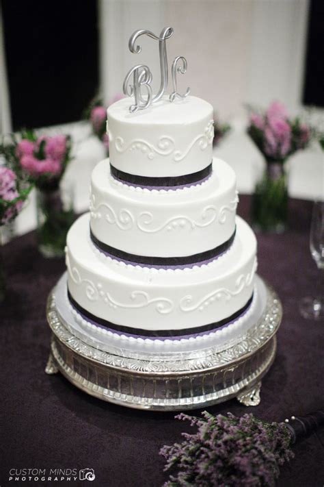 Wedding Cake with surrounding flowers at a reception in Austin Texas ...