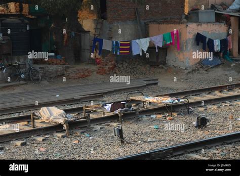 View On Railway With People Sleeping On The Track From Moving Train