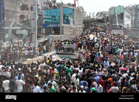 Bangladeshi People Gather As Rescuers Look For Survivors And Victims At The Site Of Rana Plaza