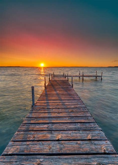 Brown Wooden Dock On Calm Water During Sunset Photo Free Water Image