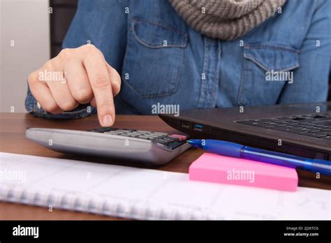 person calculating  numbers   calculator stock photo alamy