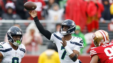 Seattle Seahawks Quarterback Geno Smith Zips 12 Yard Pass To Wide