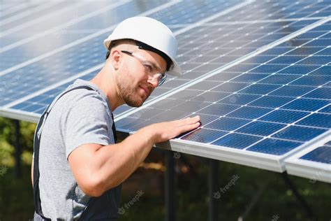 Premium Photo Solar Panel Technician Installing Solar Panels On A