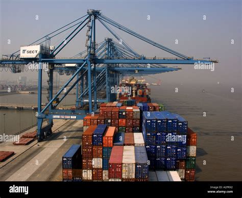 Container vessel at container terminal. Cargo operations in progress Stock Photo - Alamy