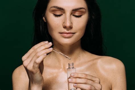 Cropped View Of Naked Woman Holding Bottle Free Stock Photo And Image