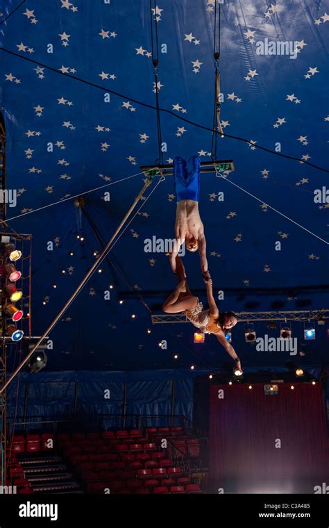 Looking up at circus trapeze artist's Stock Photo - Alamy