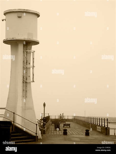 Littlehampton Lighthouse and Pier on a Misty Day in Sepia Stock Photo - Alamy