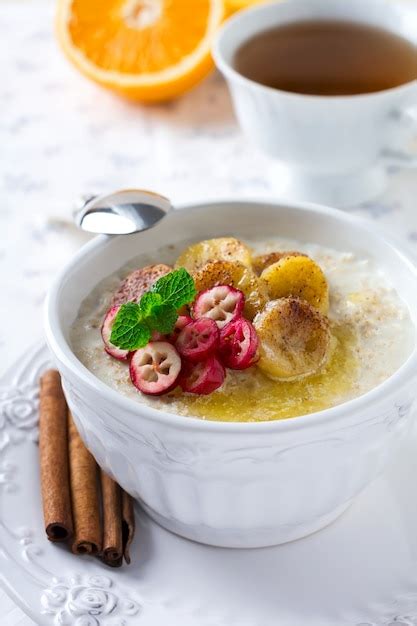 Premium Photo Oat Porridge With Baked Bananas Cinnamon Orange And