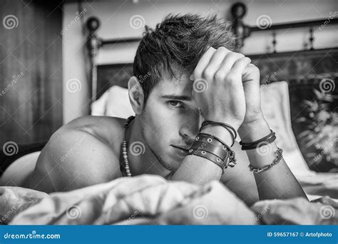 Shirtless Male Model Lying Alone On His Bed Stock Image Image Of