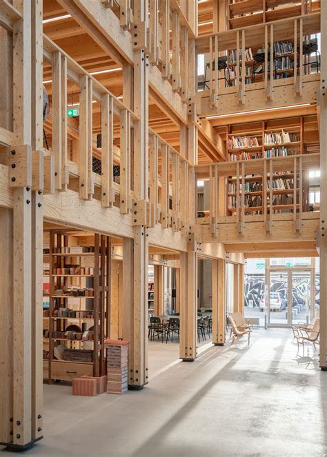 The Inside Of A Library With Wooden Bookshelves