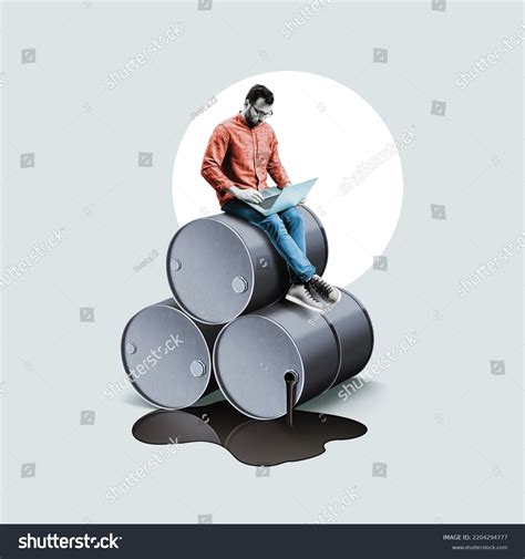 Businessman Laptop Sits On Barrels Oil Stock Photo 2204294777