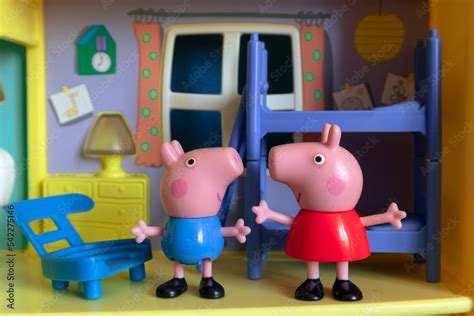 Peppa Pig's toy house. Peppa pig and George stand in the bedroom and ...